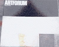 the cover of artforum with a piece of paper on it